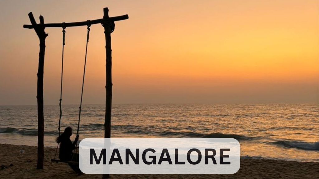 Sunset at Padubidri Beach Mangalore with silhouetted beach swings and golden sky